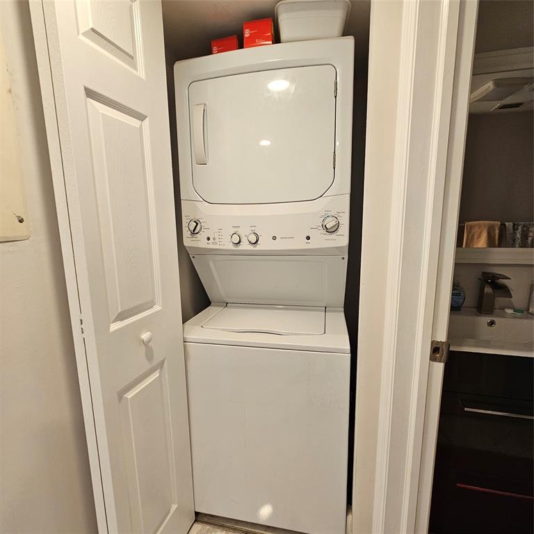 1705 Andros Isle, Unit C3 Coconut Creek, FL 33066 - Photo 35 of 36 a utility room with dryer and washer