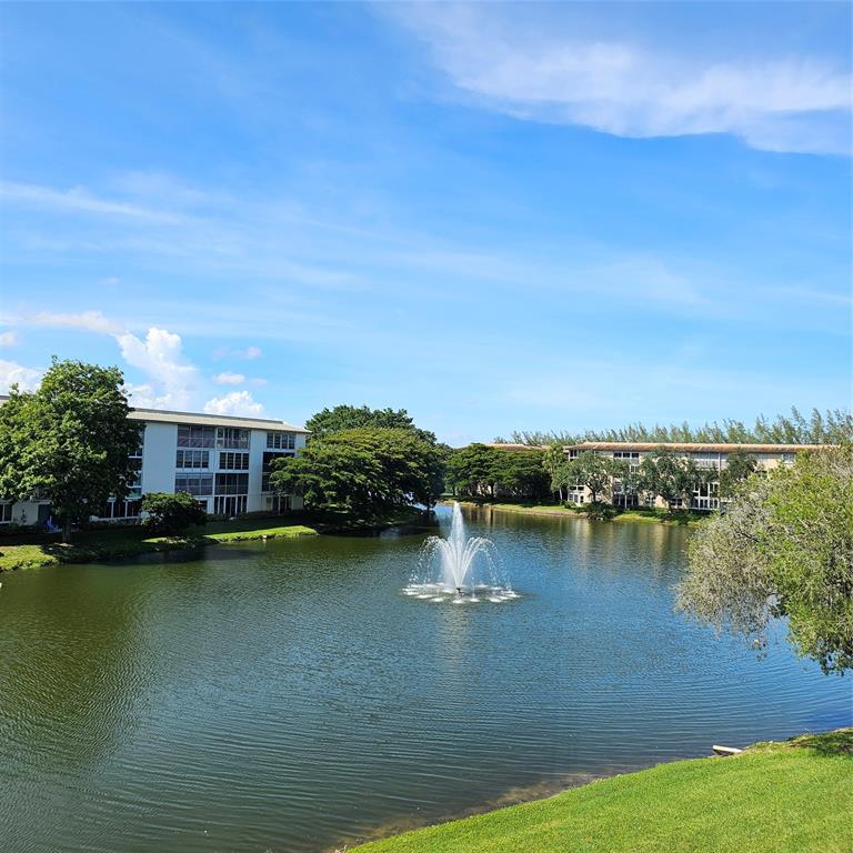 1705 Andros Isle, Unit C3 Coconut Creek, FL 33066 - Photo 4 of 36 a view of a lake with houses