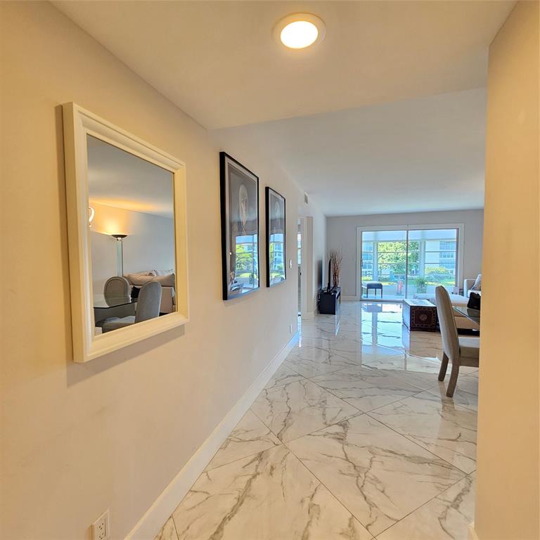 1705 Andros Isle, Unit C3 Coconut Creek, FL 33066 - Photo 5 of 36 a view of a livingroom with furniture and a window