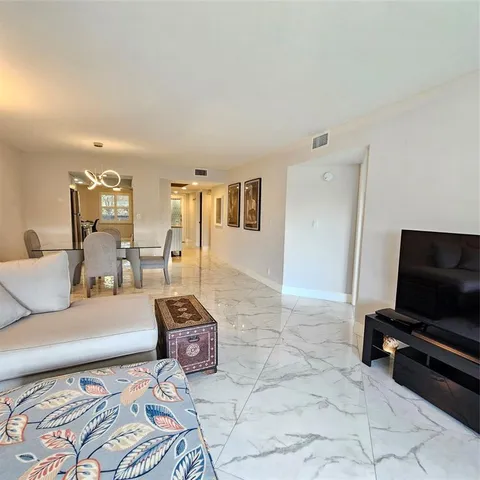 a view of hallway with wooden floor