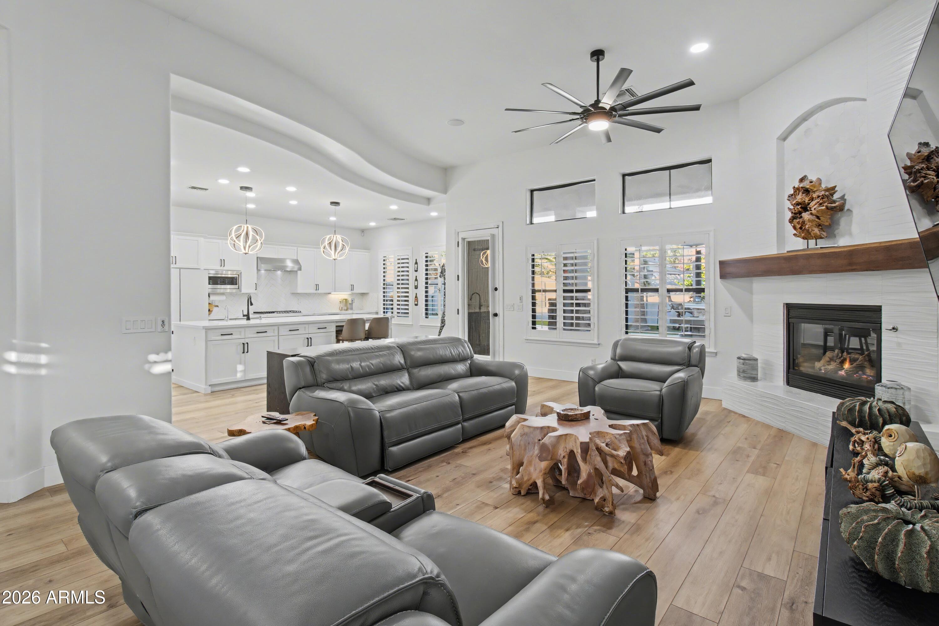 2184 West Weatherby Way Chandler, AZ 85286 - Photo 12 of 60 a living room with furniture and a fireplace