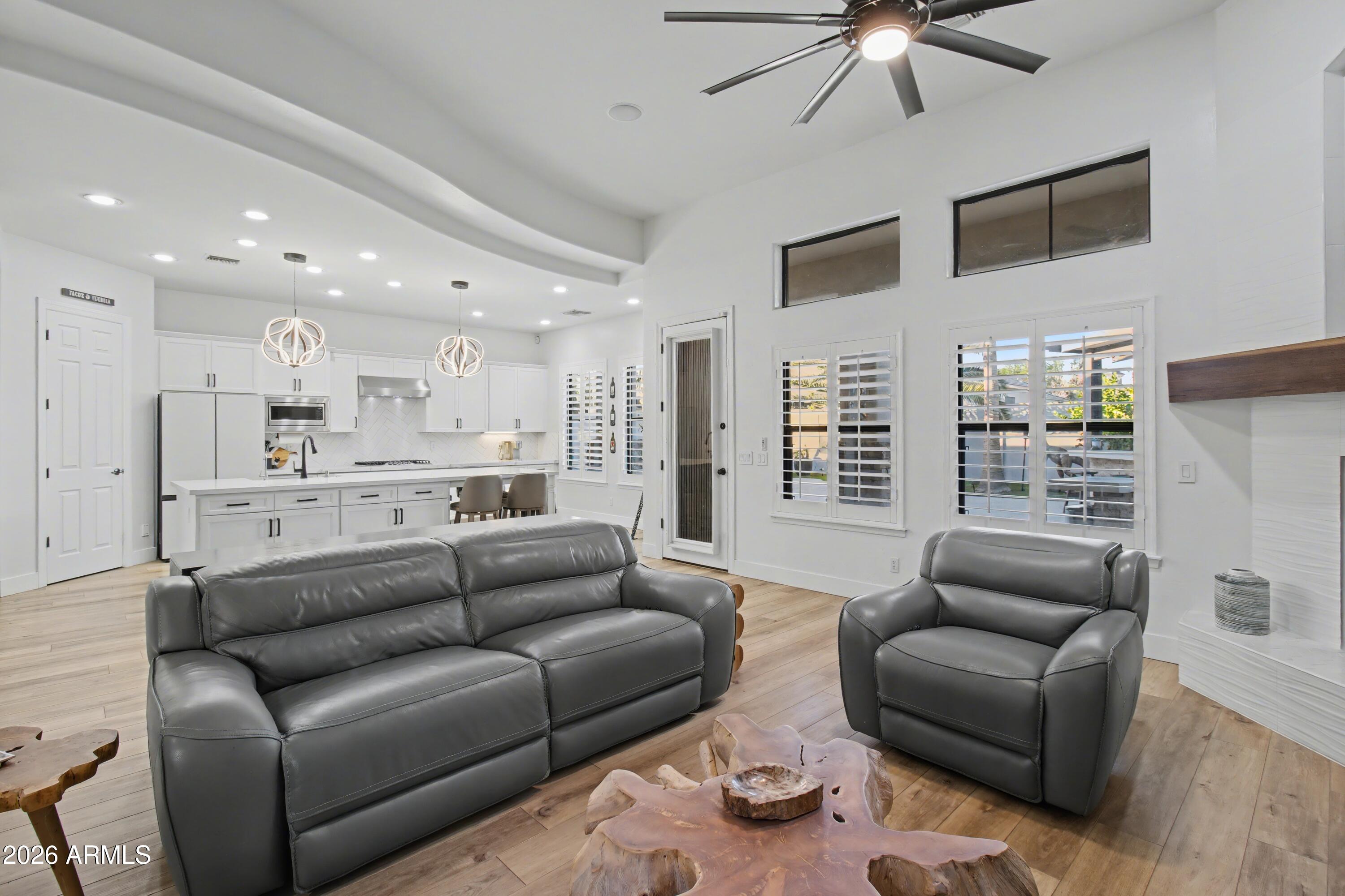 2184 West Weatherby Way Chandler, AZ 85286 - Photo 15 of 60 a view of a livingroom with furniture and a kitchen