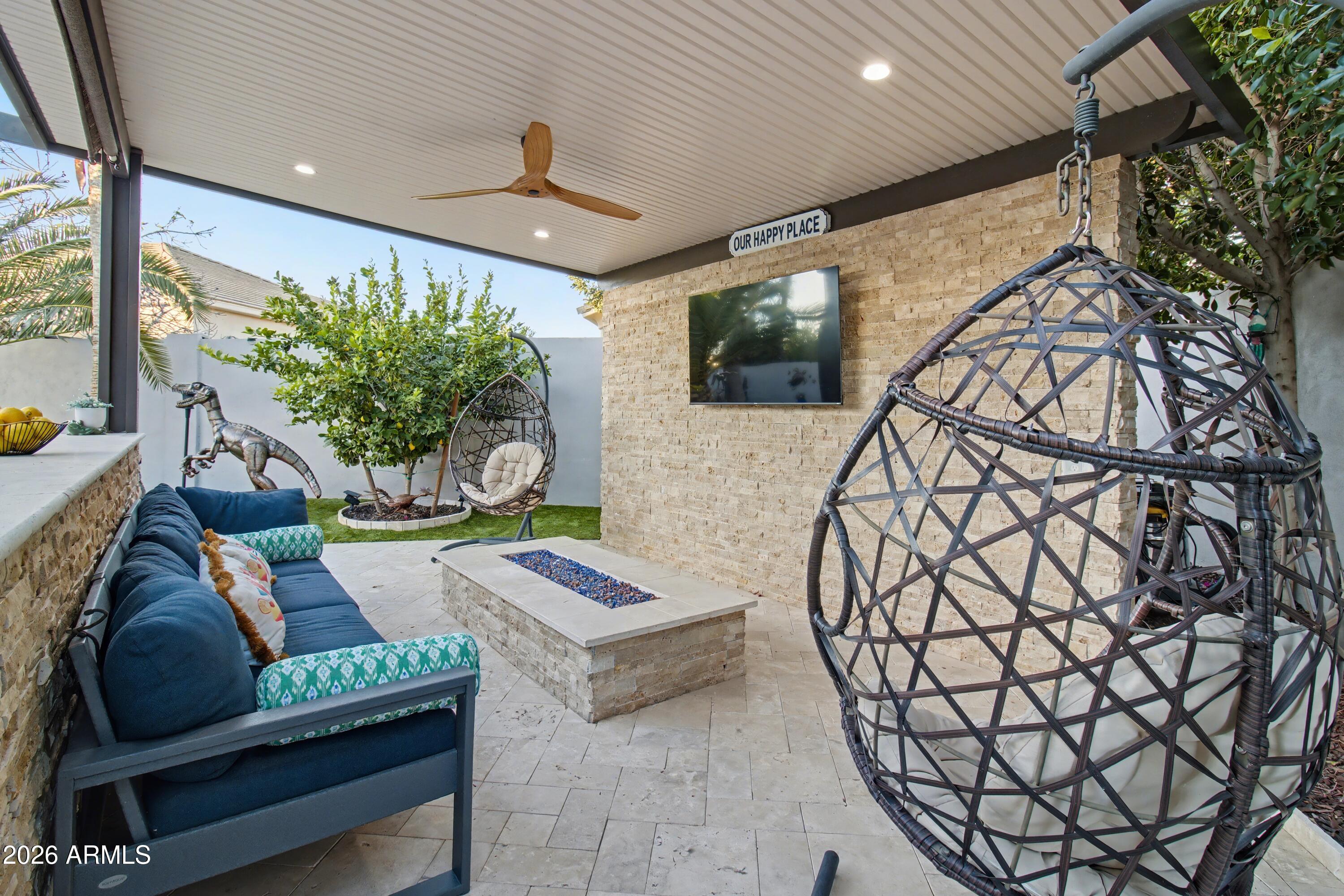 2184 West Weatherby Way Chandler, AZ 85286 - Photo 20 of 60 a living room with furniture and a flat screen tv