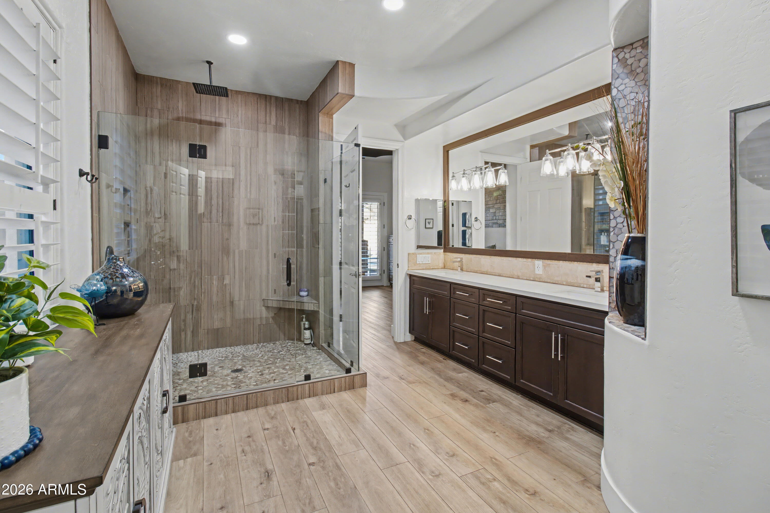 2184 West Weatherby Way Chandler, AZ 85286 - Photo 28 of 60 a large bathroom with a granite countertop tub a double vanity sink a mirror and a shower
