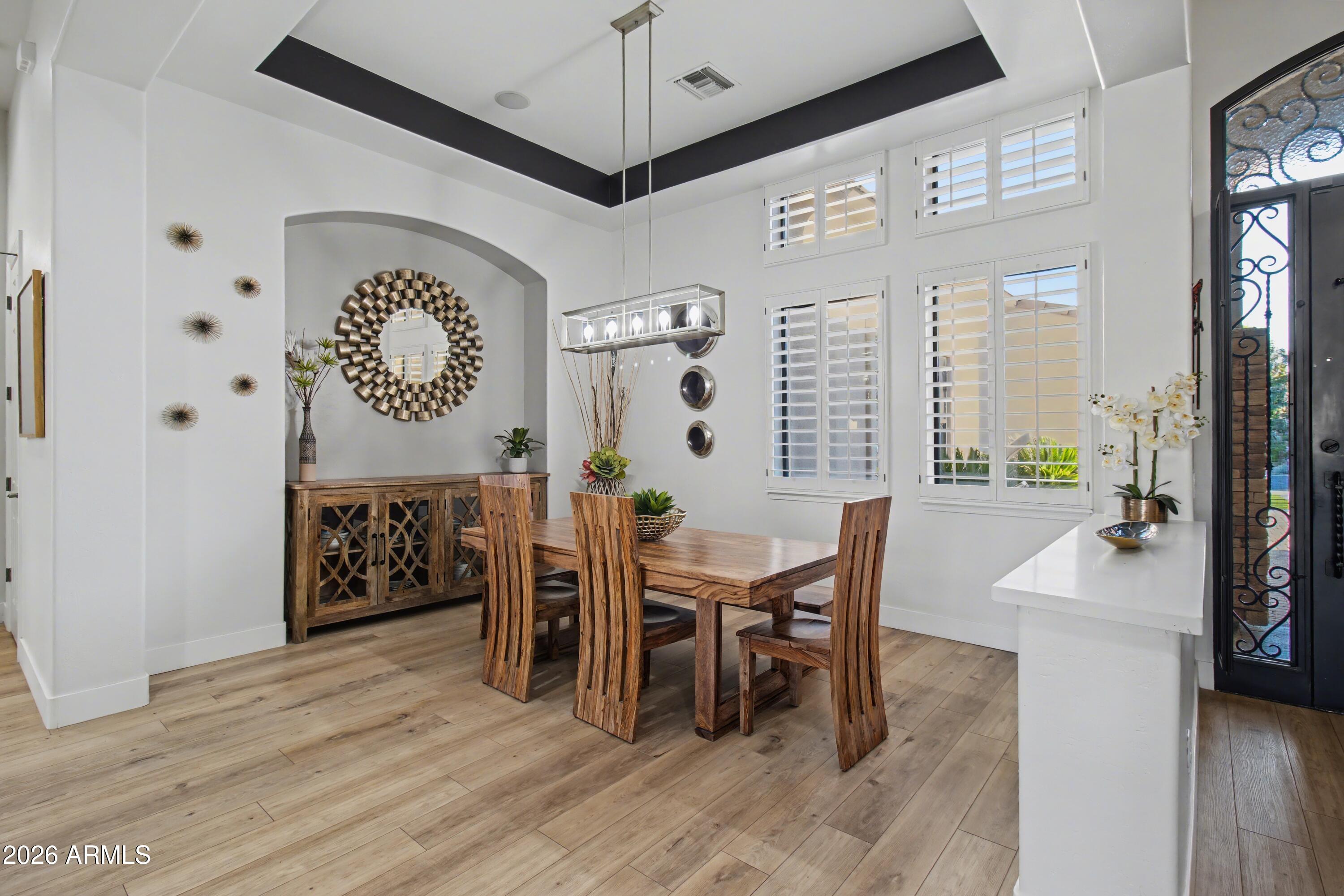 2184 West Weatherby Way Chandler, AZ 85286 - Photo 32 of 60 a view of a dining room with furniture and chandelier