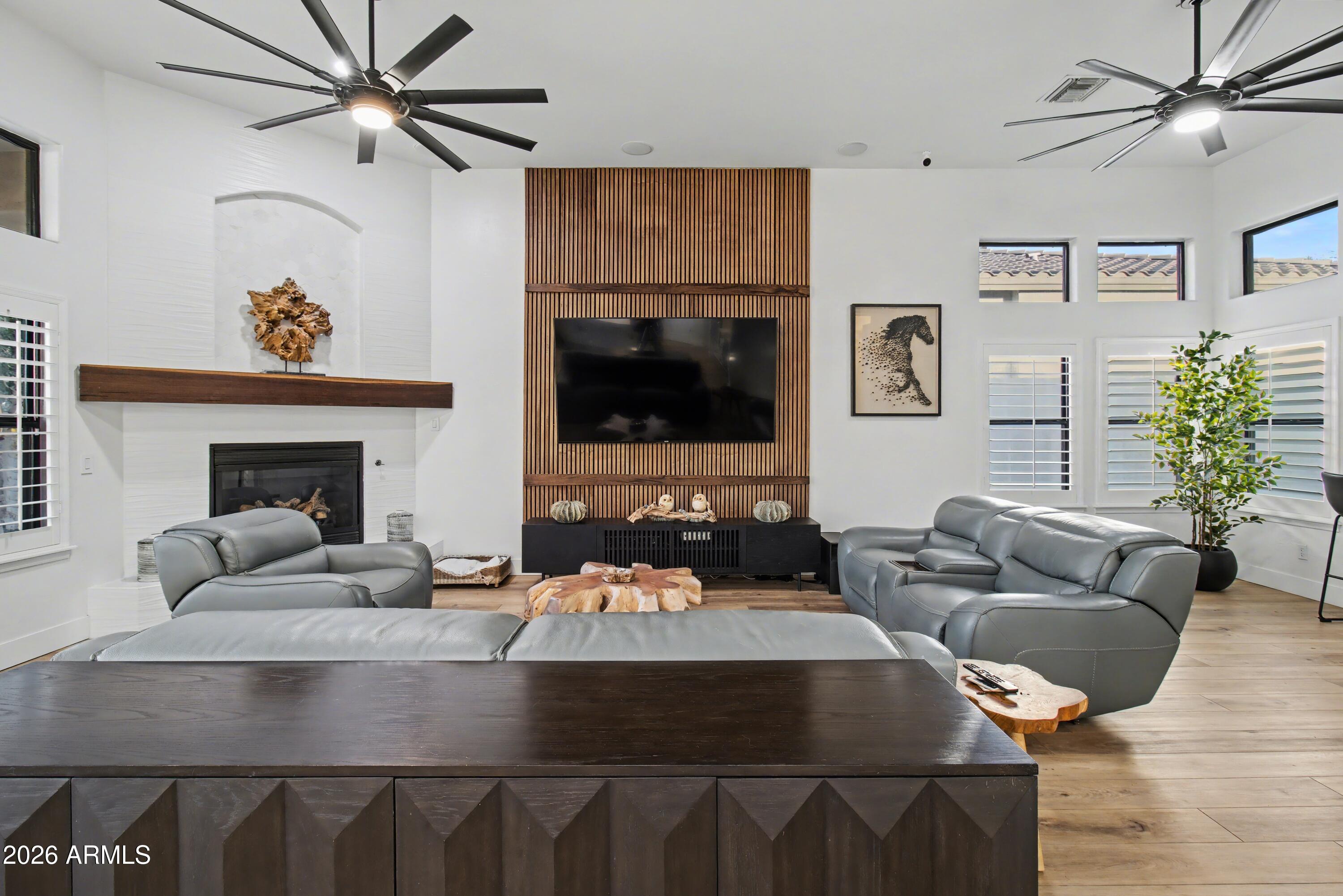 2184 West Weatherby Way Chandler, AZ 85286 - Photo 34 of 60 a living room with furniture and a fireplace