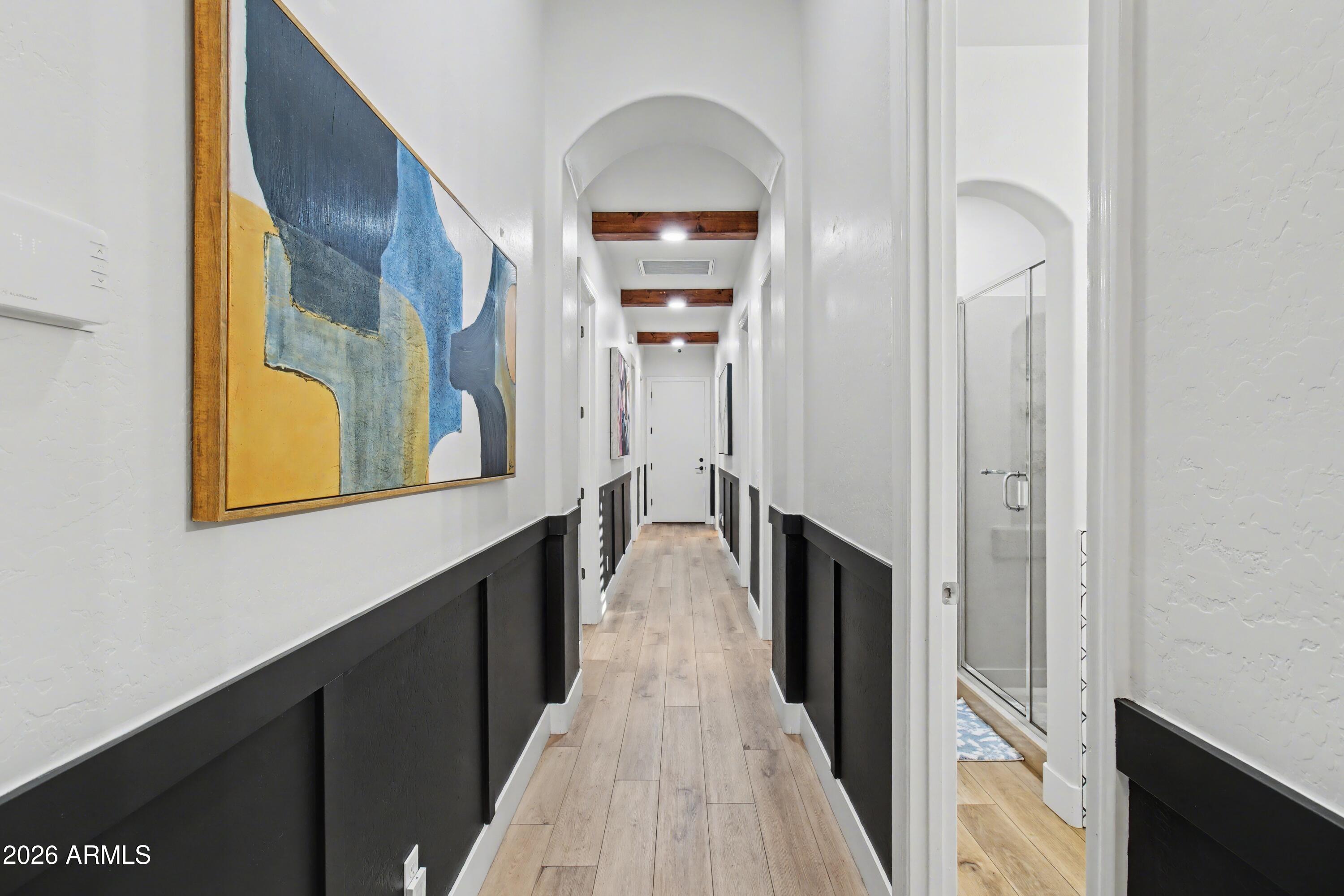 2184 West Weatherby Way Chandler, AZ 85286 - Photo 37 of 60 a view of a hallway with wooden floor and staircase