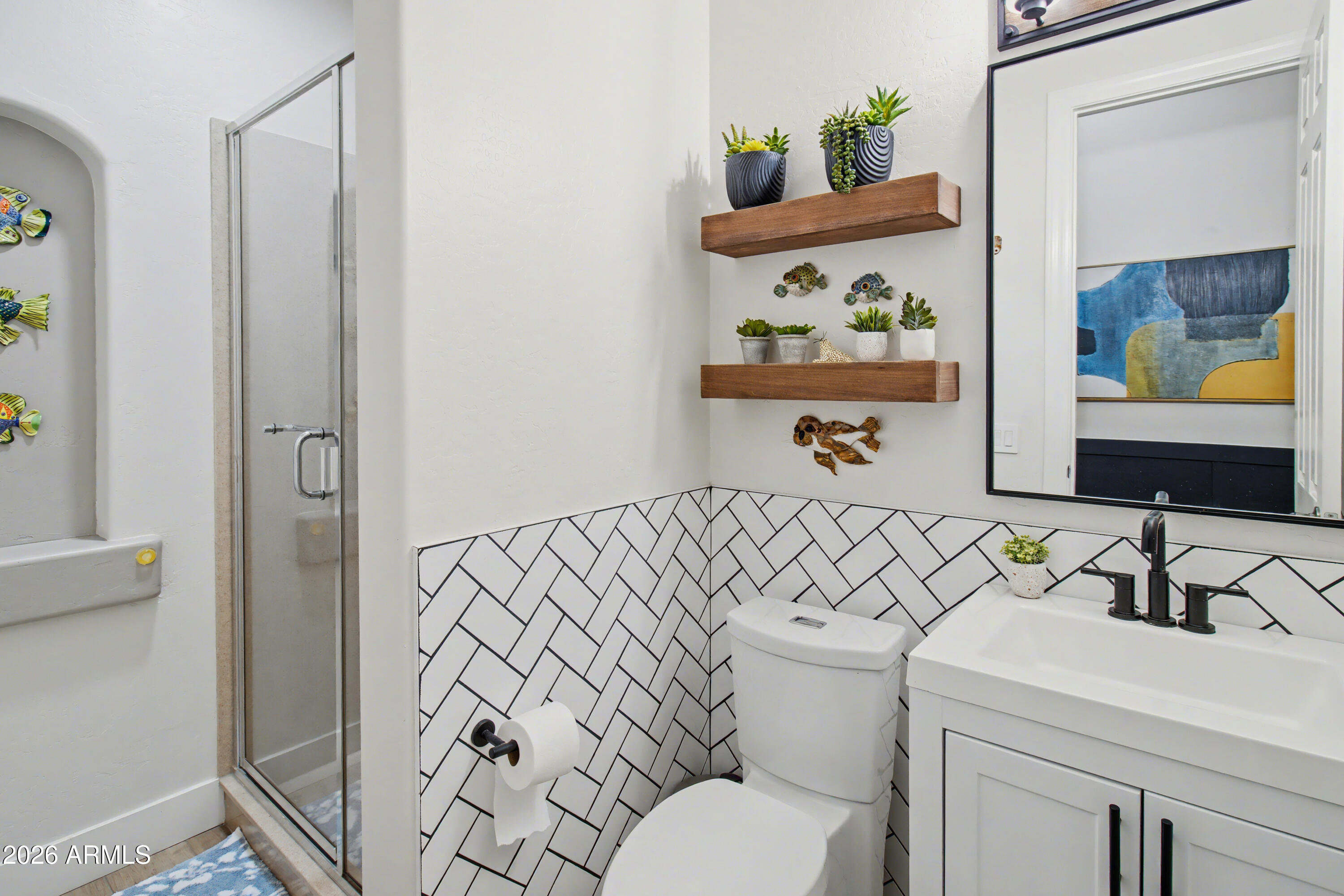 2184 West Weatherby Way Chandler, AZ 85286 - Photo 38 of 60 a bathroom with a sink a toilet and a shower curtain