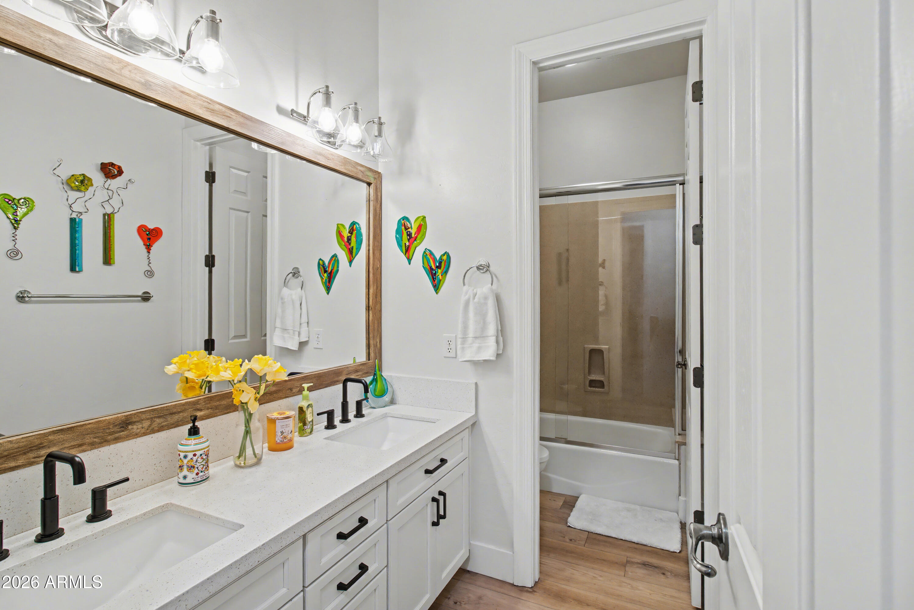 2184 West Weatherby Way Chandler, AZ 85286 - Photo 44 of 60 a bathroom with sink mirror and glass door