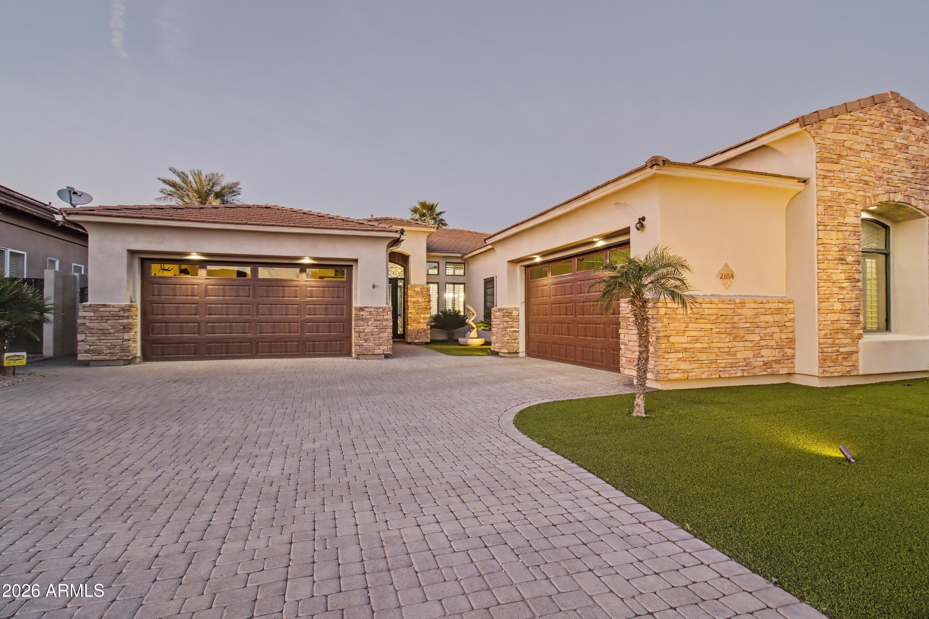 2184 West Weatherby Way Chandler, AZ 85286 - Photo 53 of 60 a front view of a house with a yard