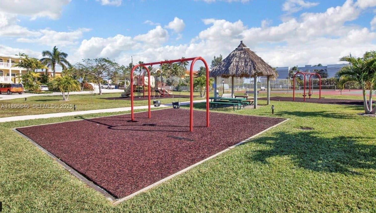 251 2nd Street Key Colony Beach, FL 33051 - Photo 16 of 20 a view of a park with swings and slides