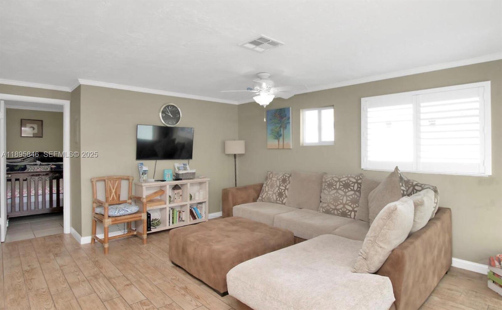 251 2nd Street Key Colony Beach, FL 33051 - Photo 5 of 20 a living room with furniture and a flat screen tv