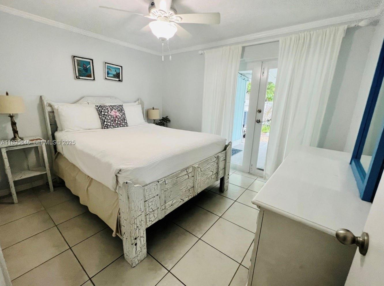 251 2nd Street Key Colony Beach, FL 33051 - Photo 8 of 20 a bedroom with a bed and a table