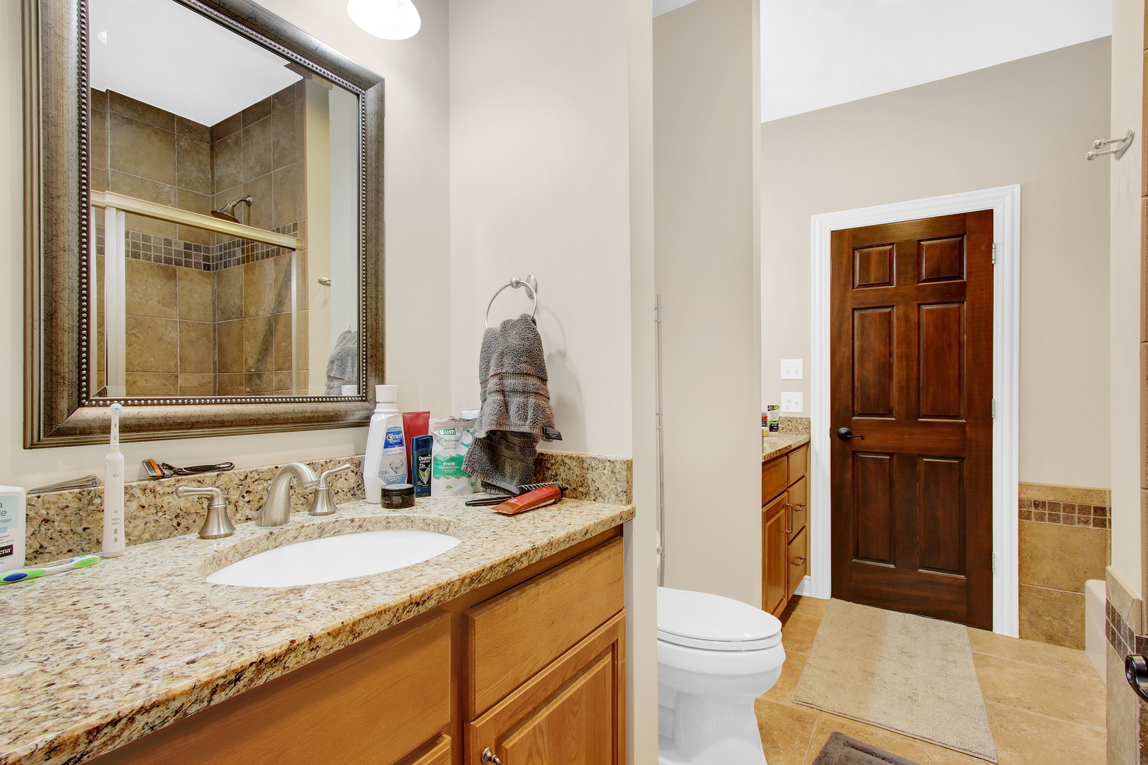 17451 Bridle Trail Road Gurnee, IL 60031 - Photo 105 of 121 a bathroom with a granite countertop sink mirror vanity and toilet
