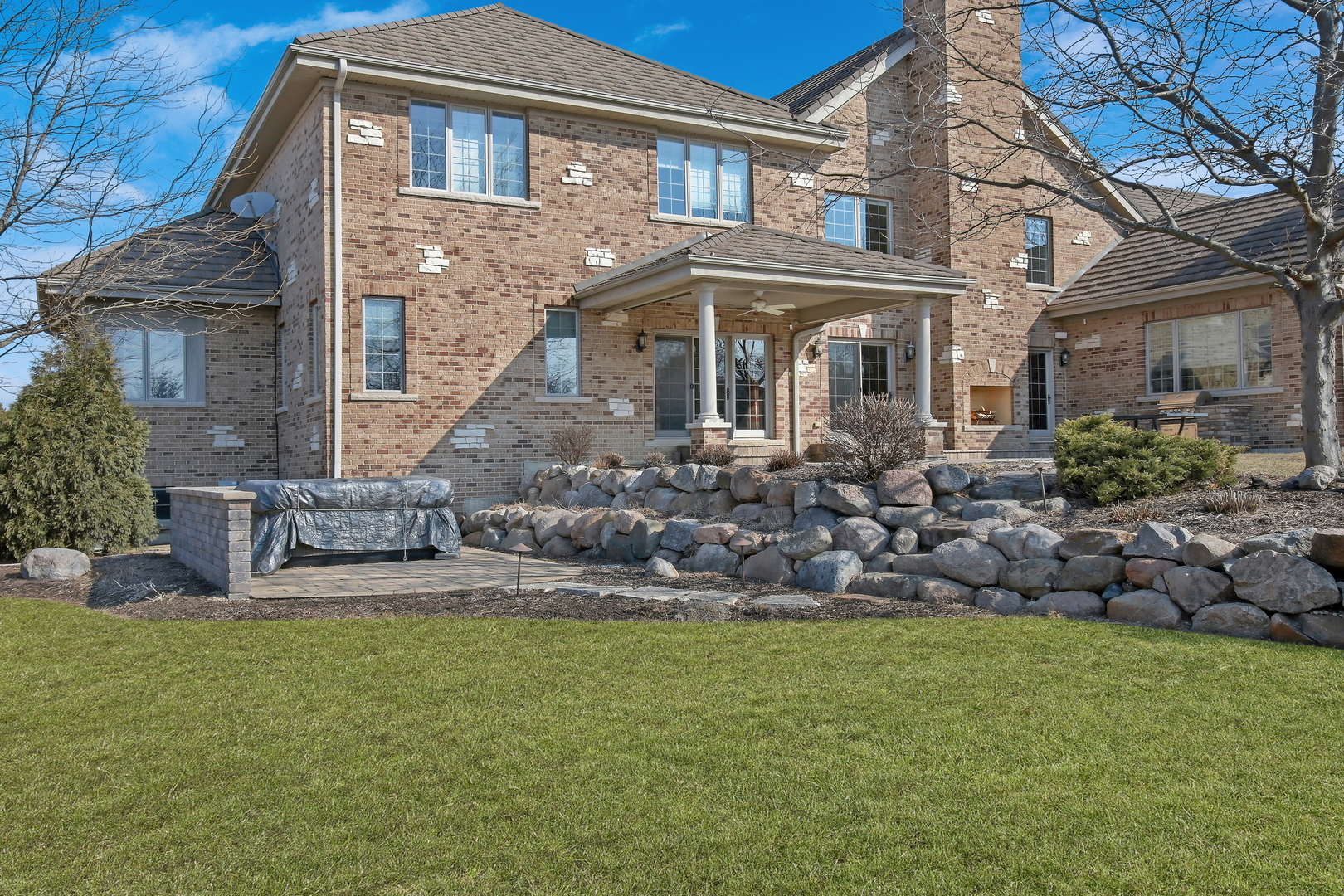 17451 Bridle Trail Road Gurnee, IL 60031 - Photo 39 of 121 a front view of a house with a garden and plants