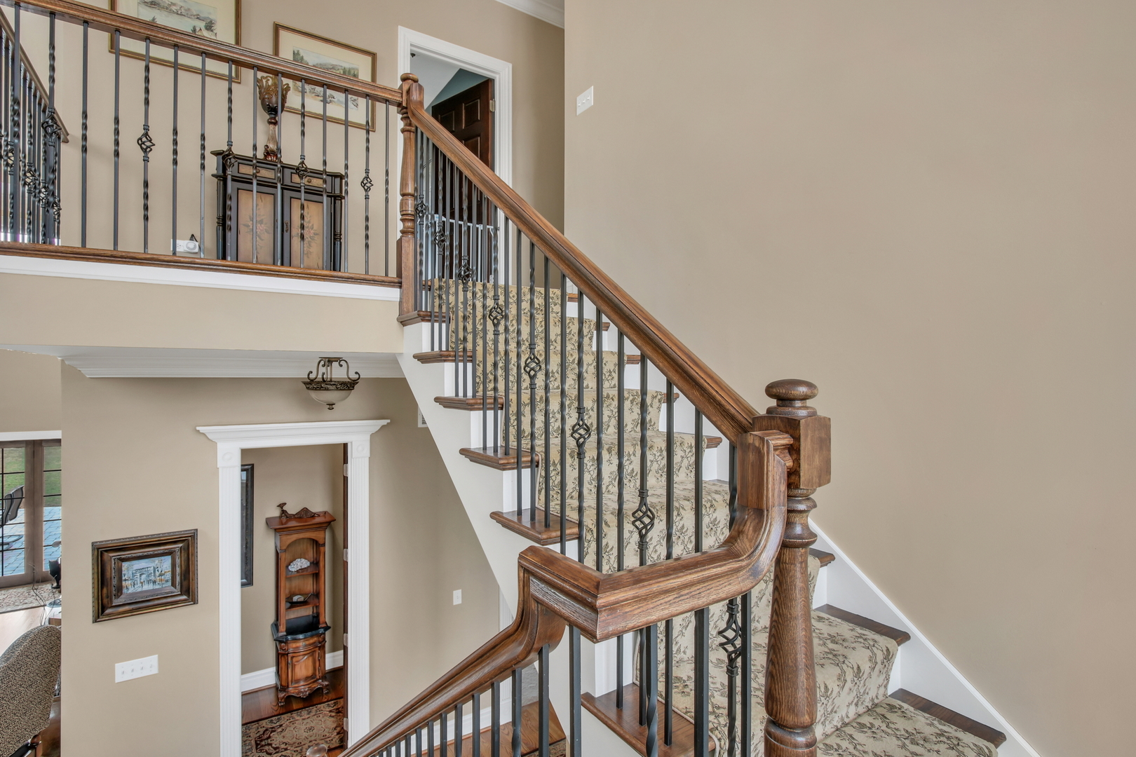 17451 Bridle Trail Road Gurnee, IL 60031 - Photo 43 of 121 a view of staircase with lots of frames on wall and a window