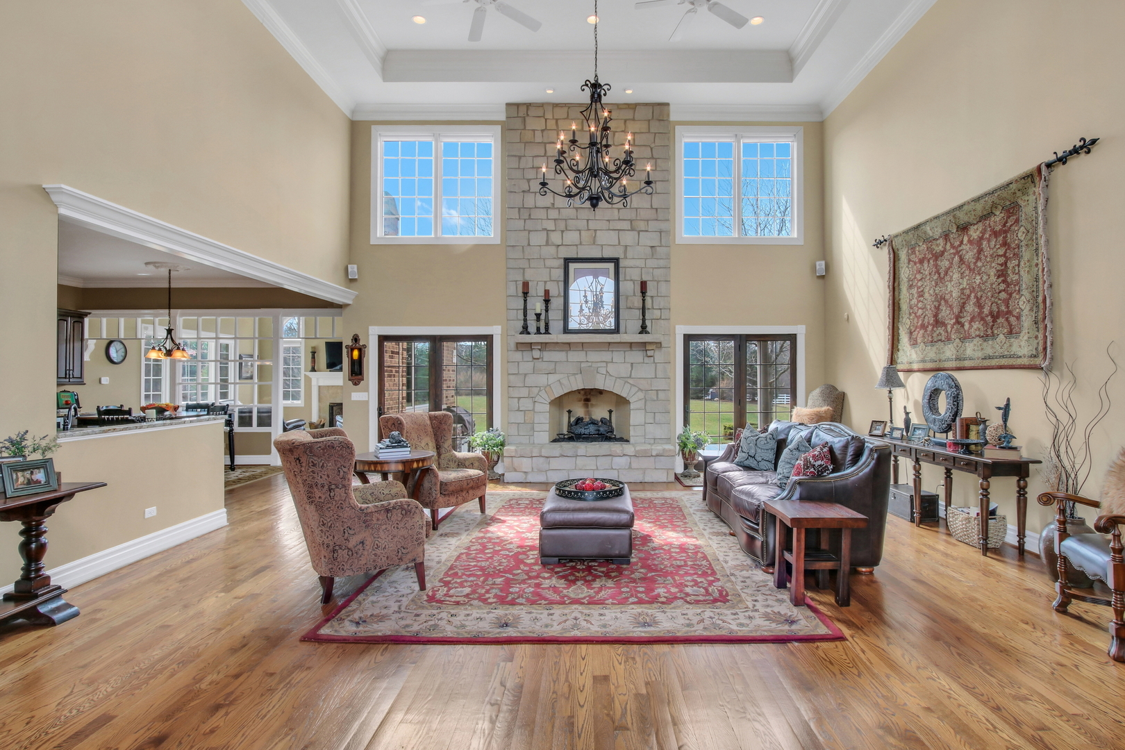 17451 Bridle Trail Road Gurnee, IL 60031 - Photo 5 of 121 a living room with furniture a fireplace and a chandelier