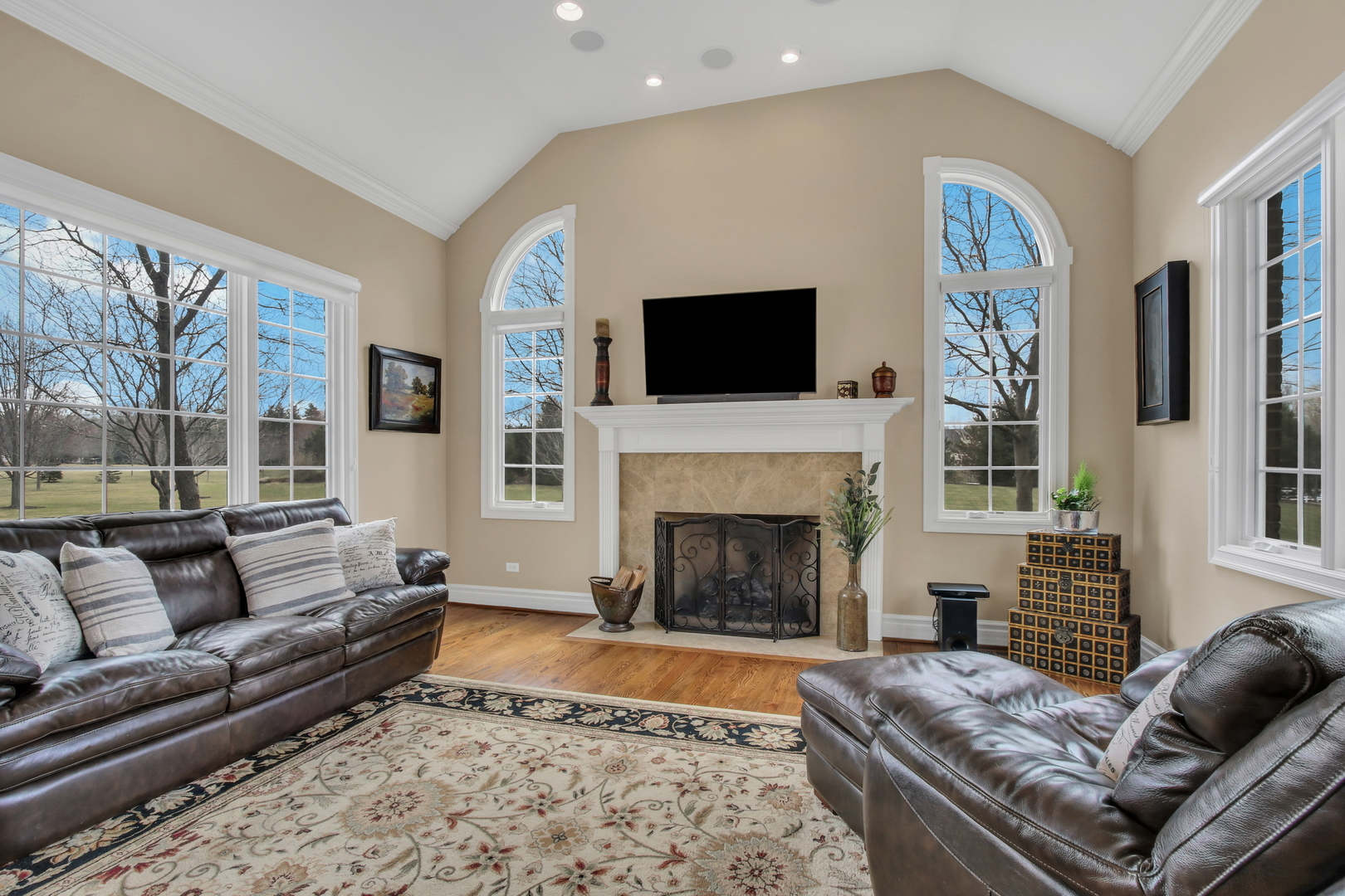 17451 Bridle Trail Road Gurnee, IL 60031 - Photo 10 of 121 a living room with furniture a flat screen tv and a fireplace
