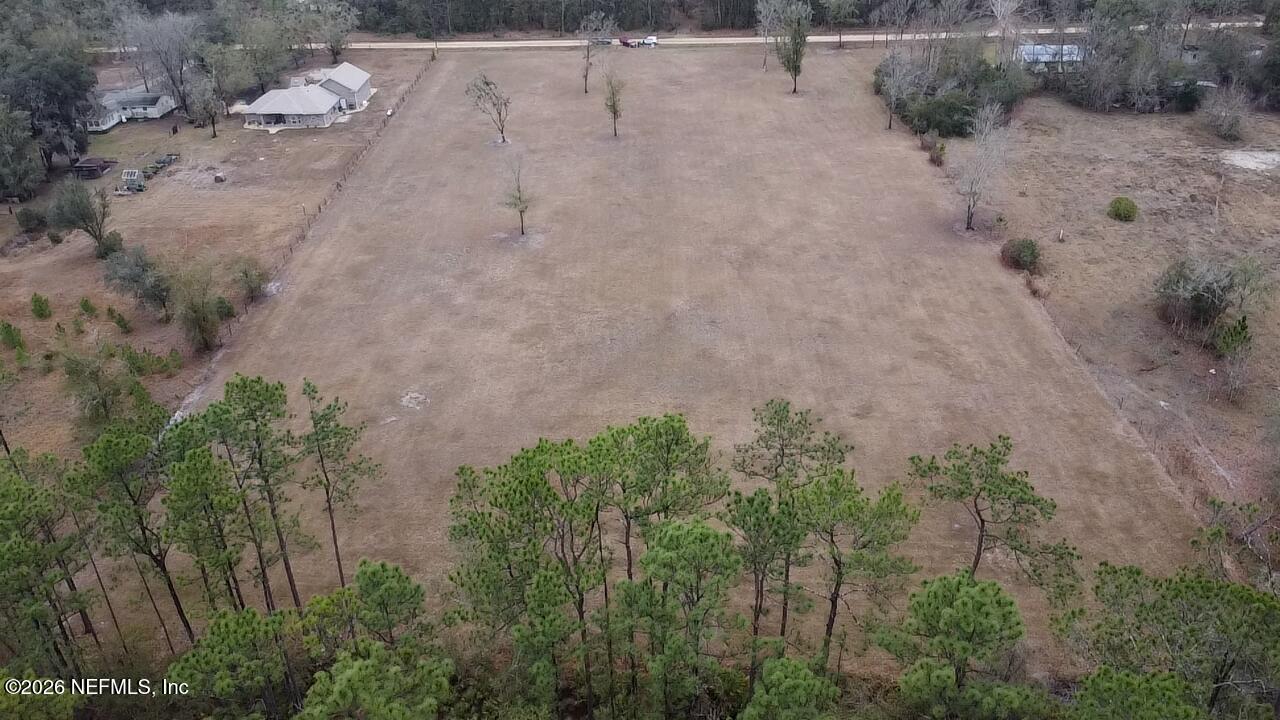 6116 Jack Wilkinson Road Jacksonville, FL 32234 - Photo 6 of 7 a view of a dry yard with trees