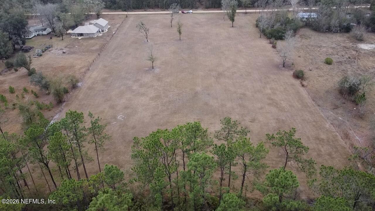 6116 Jack Wilkinson Road Jacksonville, FL 32234 - Photo 7 of 7 a view of a dry yard with trees