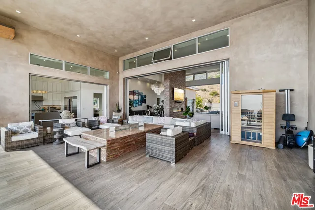 a view of swimming pool with outdoor seating