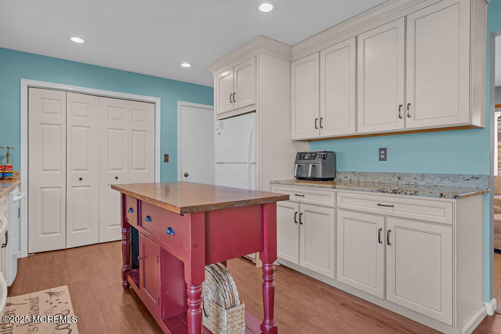 826 Forepeak Drive Forked River, NJ 08731 - Photo 11 of 56 a kitchen with stainless steel appliances granite countertop a sink and cabinets