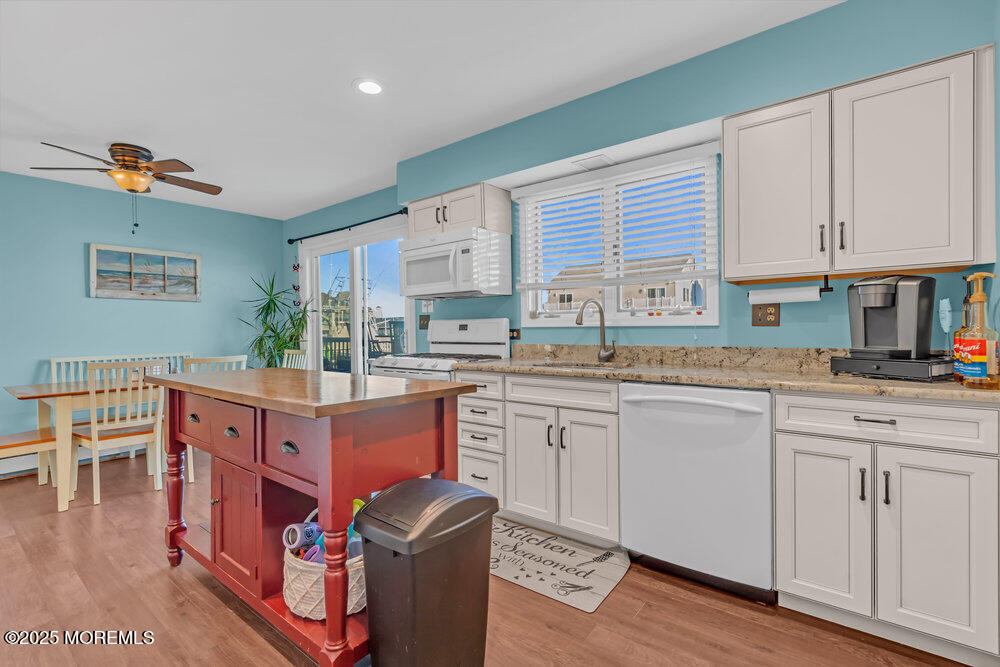 826 Forepeak Drive Forked River, NJ 08731 - Photo 15 of 56 a kitchen with cabinets a counter top space and a window