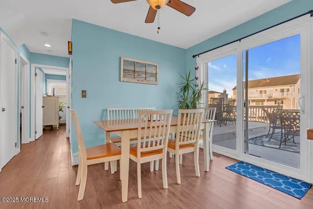 a bathroom with a toilet a sink and a mirror