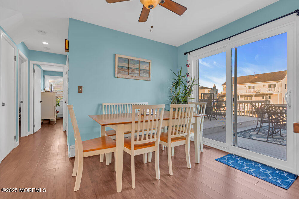 826 Forepeak Drive Forked River, NJ 08731 - Photo 17 of 56 a view of a dining room with furniture window and wooden floor