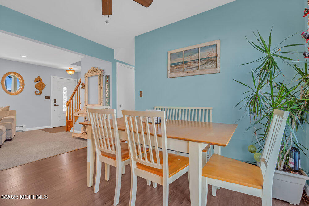 826 Forepeak Drive Forked River, NJ 08731 - Photo 18 of 56 a view of a dining room with furniture and a potted plant