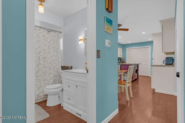 a bedroom with a bed couch and window