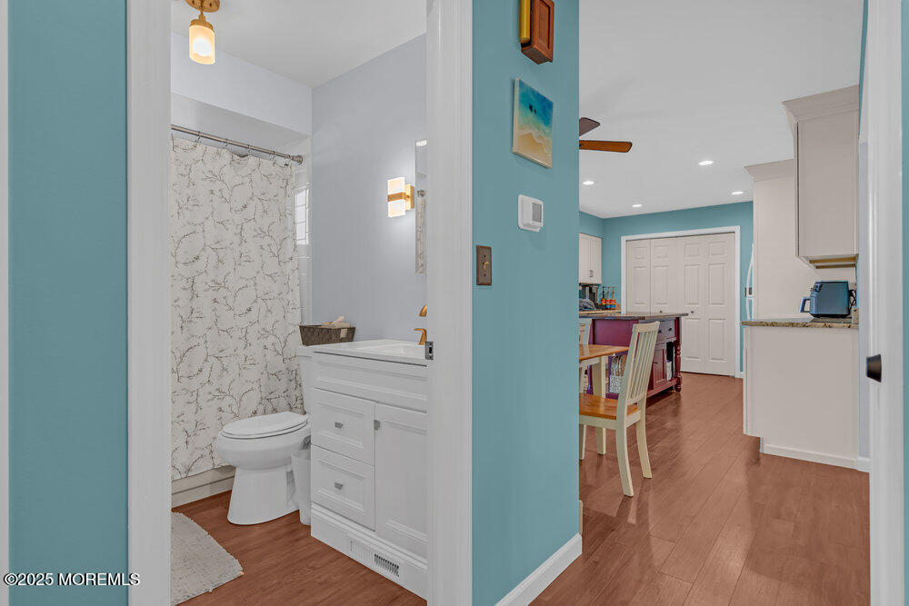 826 Forepeak Drive Forked River, NJ 08731 - Photo 19 of 56 a bathroom with a toilet a sink and a mirror