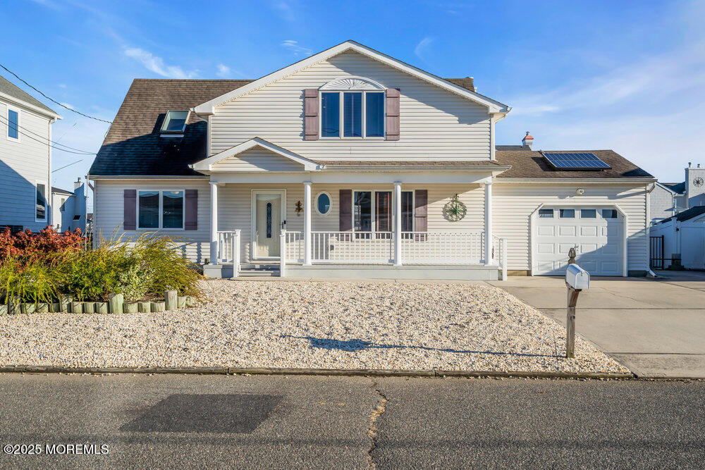 826 Forepeak Drive Forked River, NJ 08731 - Photo 2 of 56 front view of a house with a yard
