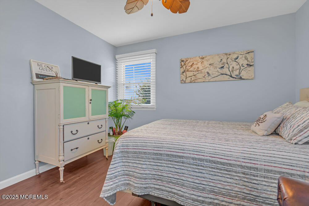 826 Forepeak Drive Forked River, NJ 08731 - Photo 22 of 56 a bedroom with a bed and a flat screen tv