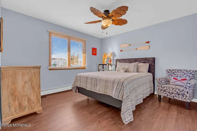 a bathroom with a sink a toilet and a shower curtain