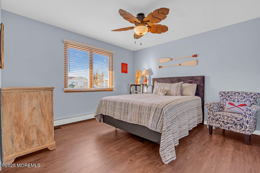 826 Forepeak Drive Forked River, NJ 08731 - Photo 23 of 56 a bedroom with a bed and a window