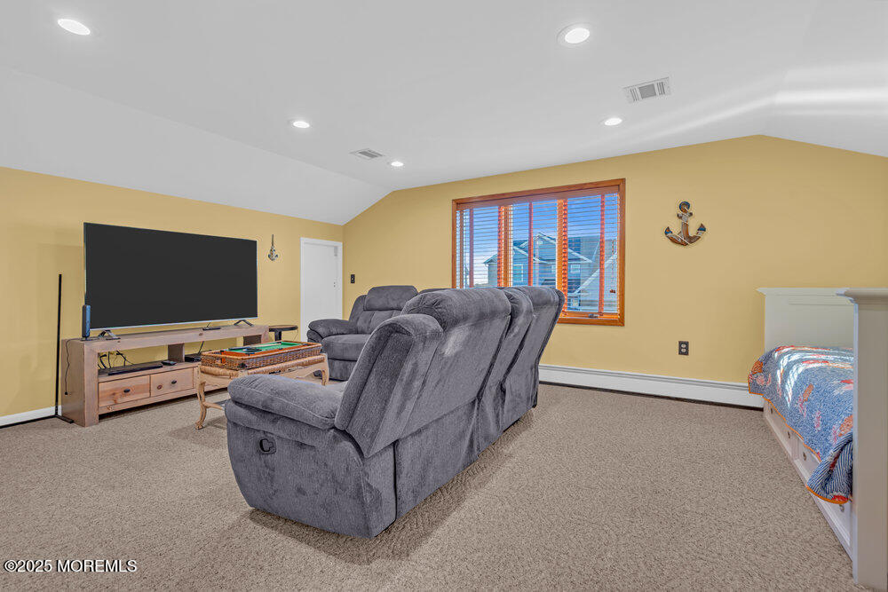 826 Forepeak Drive Forked River, NJ 08731 - Photo 28 of 56 a living room with furniture and a flat screen tv
