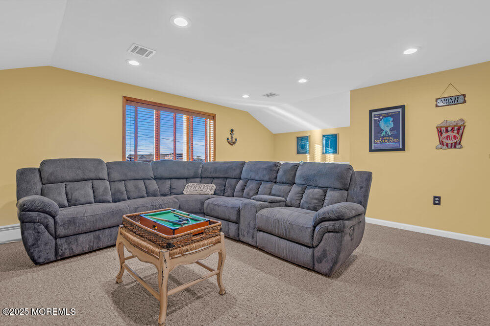 826 Forepeak Drive Forked River, NJ 08731 - Photo 29 of 56 a living room with furniture a window and a flat screen tv