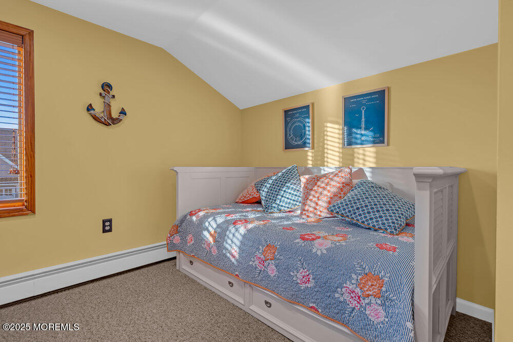 826 Forepeak Drive Forked River, NJ 08731 - Photo 30 of 56 a bedroom with a bed and painting on the wall