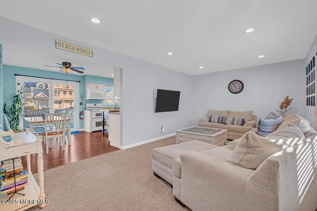 a bedroom with furniture and a flat screen tv