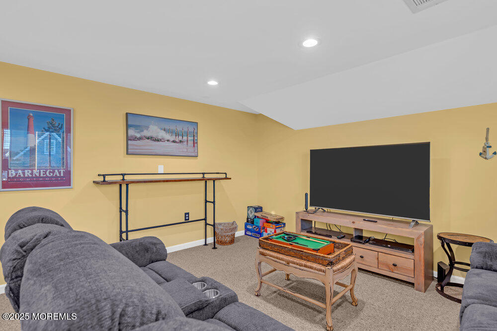 826 Forepeak Drive Forked River, NJ 08731 - Photo 32 of 56 a living room with furniture and a flat screen tv