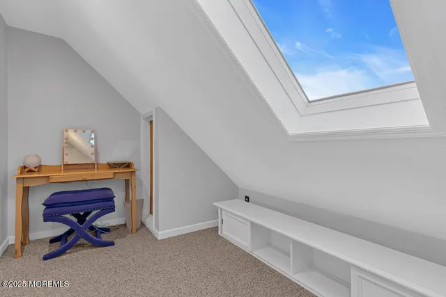 a bathroom with a granite countertop toilet and a sink