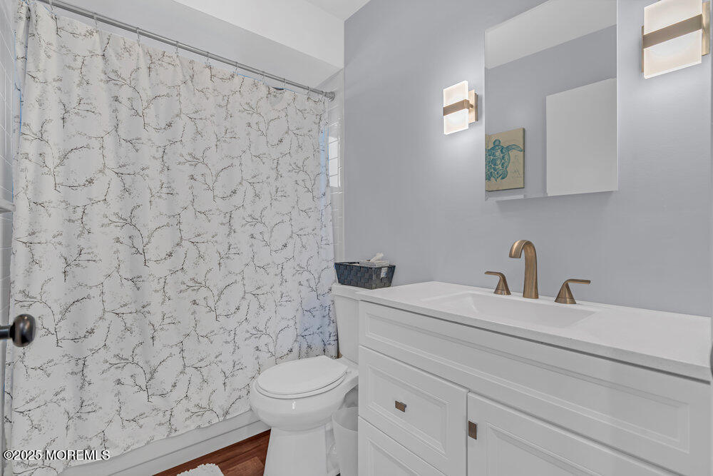826 Forepeak Drive Forked River, NJ 08731 - Photo 37 of 56 a bathroom with a granite countertop toilet and a sink
