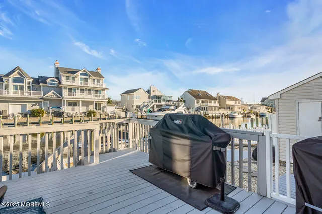 a view of staircase with wooden floor and a rug