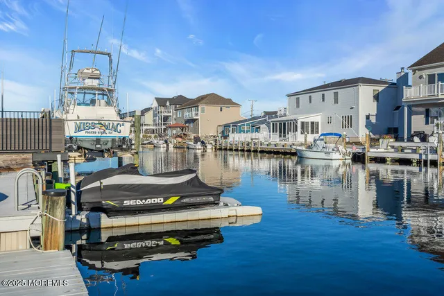 a view of a lake with outdoor seating
