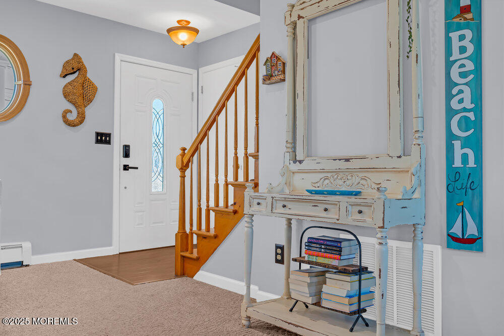 826 Forepeak Drive Forked River, NJ 08731 - Photo 8 of 56 a view of an entryway with wooden floor