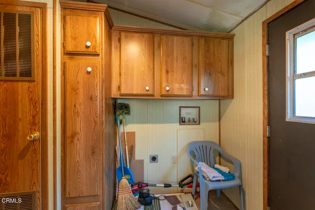 a view of cabinets and utility room