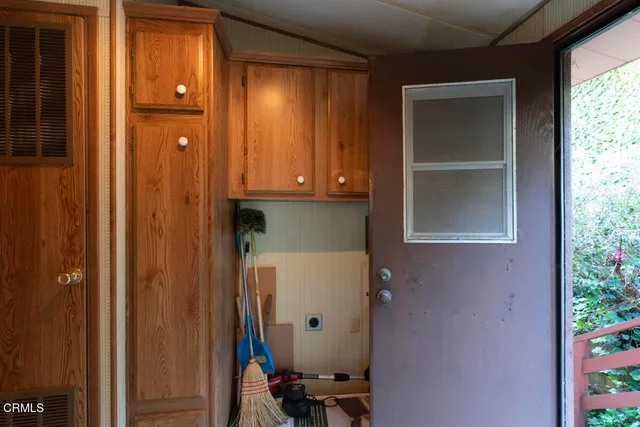 a view of balcony with wooden floor and fence