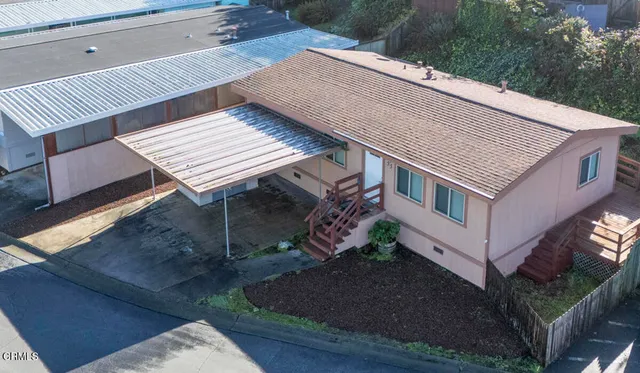 a view of a roof deck with wooden floor and fence