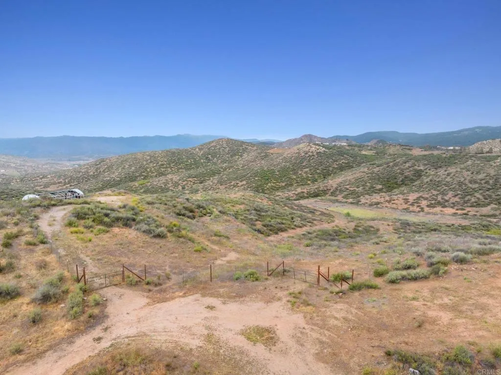 0 Ravenna Lane Rancho Cucamonga, CA 91737 - Photo 1 of 47 a view of a mountain range in a cloudy sky